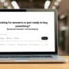 Laptop screen displaying ChatGPT interface with the message: 'Looking for answers or just ready to buy something? Sponsored answers™ are standing by.'